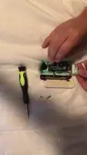 Use tweezers to lift the ZL button a little then pull upwards to get it back into place.