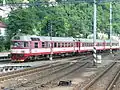 854.217 vor dem Schnellzug Liberec–Ústí nad Labem 2014 im Bahnhof Decin h.l.n.
