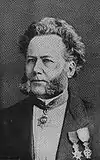 Ibsen mit dem Vasa-Orden, dem Dannebrog-Orden und dem türkischen Medijdij-Ordensband als Halsgeschmeide