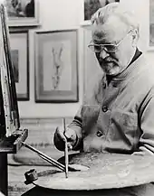 Schwarzweiß-Fotografie: Richard Eberle mit Farbpalette und Staffelei im Atelier 1993