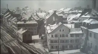Fischerrain um 1902.Vorne mit Bahnwärterhaus; heute verläuft hier der Stadtring (Rusterberg). Am Horizont links die Heilig-Geist-Kirche, noch ohne vollendetem Hauptturm (provisorisches Dach)