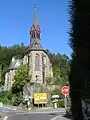 Schmitten Kirche, frontal von der Landesstraße&nbsp;3025 (Schillerstraße) aus fotografiert