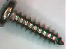 Farbiges 3D-Anaglyphenbild aus dem Stereomikroskop für Rot-Cyan-Brillen, Motiv: Blechschraube &nbsp;