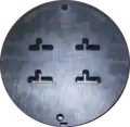 Front side of a four family die. The die is 228&nbsp;mm (9.0&nbsp;in) in diameter.