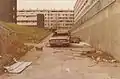Subway in Netherley, Liverpool vandalised, burned-out car, awaiting demolition (December 1983)