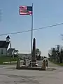 World War I veterans memorial in Pickrelltown (2010 photo). The 8 ft (2.4 m) high granite monument was erected in 1921, and has twice been rebuilt after vehicles crashed into it.
