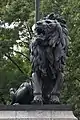 Lion sculpture on the right pedestal.