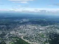 Worcester and the surrounding areas in 2006, looking north from 3,700 feet (1,100&nbsp;m). Route 146 can be seen under construction.