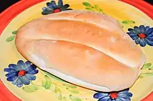 An oval-shaped loaf of bread on a plate